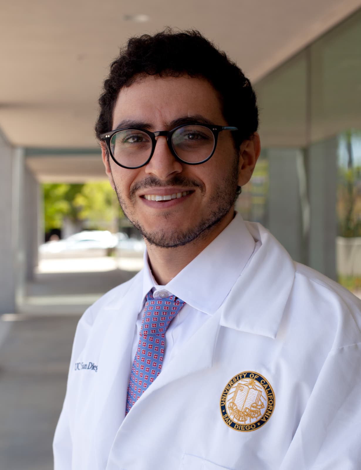 Portrait of Dr. Ash, M.D., Co-Founder and Ophthalmologist at Pheelio, in professional attire