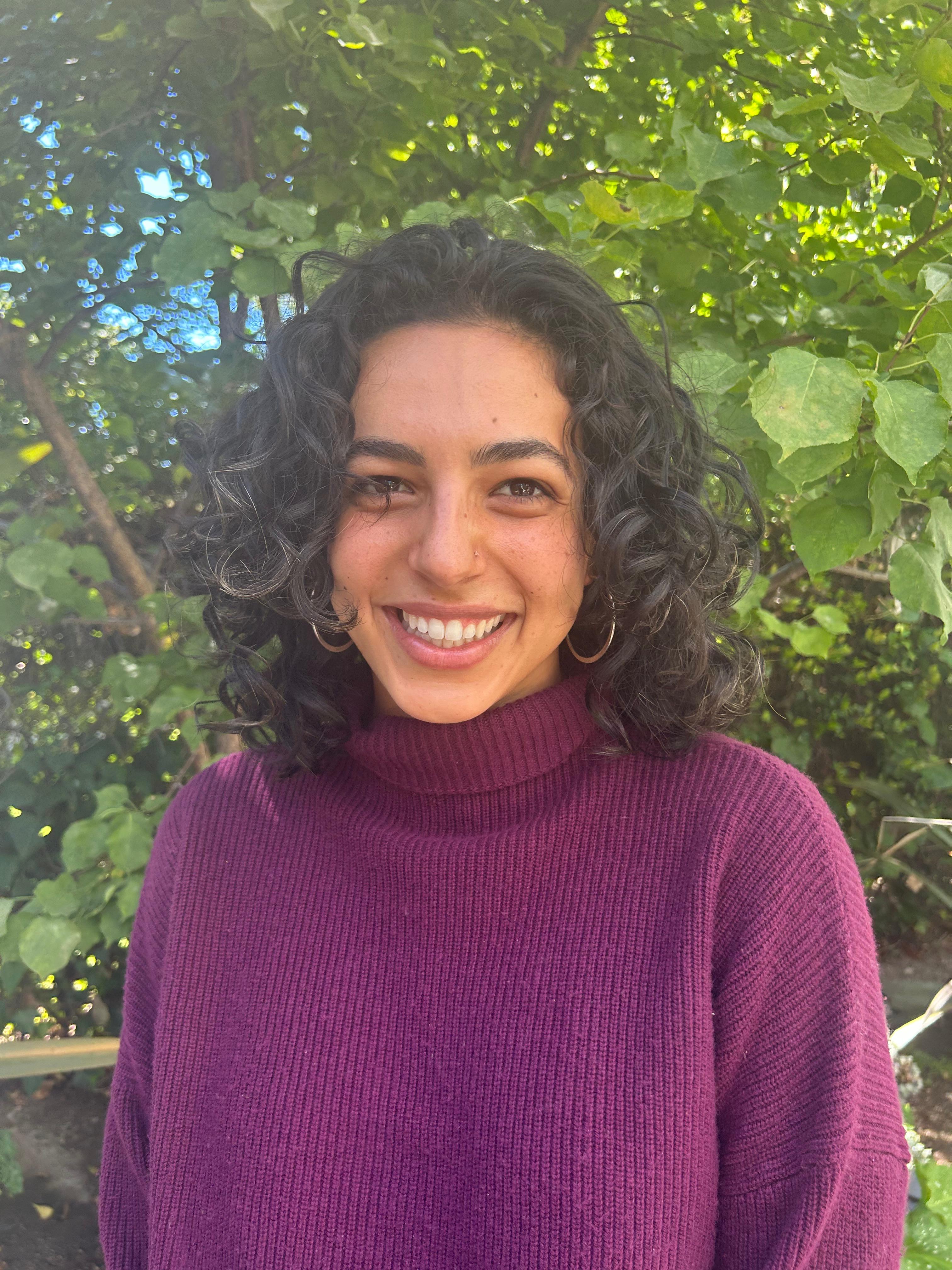 Portrait of Shaya, Co-Founder and Engineer at Pheelio, smiling professionally